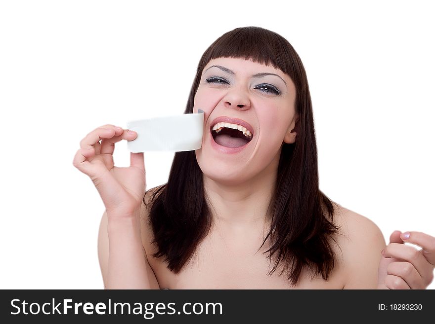 Young woman tears off an adhesive tape from a mouth. Freedom of speech concept