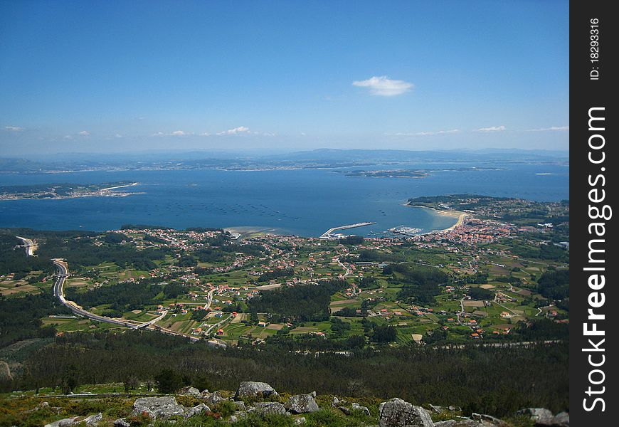 Big blue estuary, a town and country fields from the top of a hill