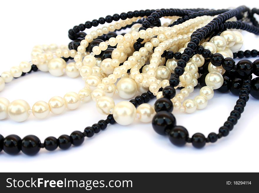 White and black necklaces isolated on white background.