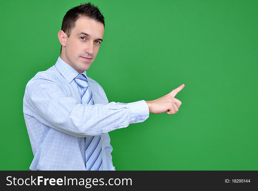 Young business man pointing with his finger