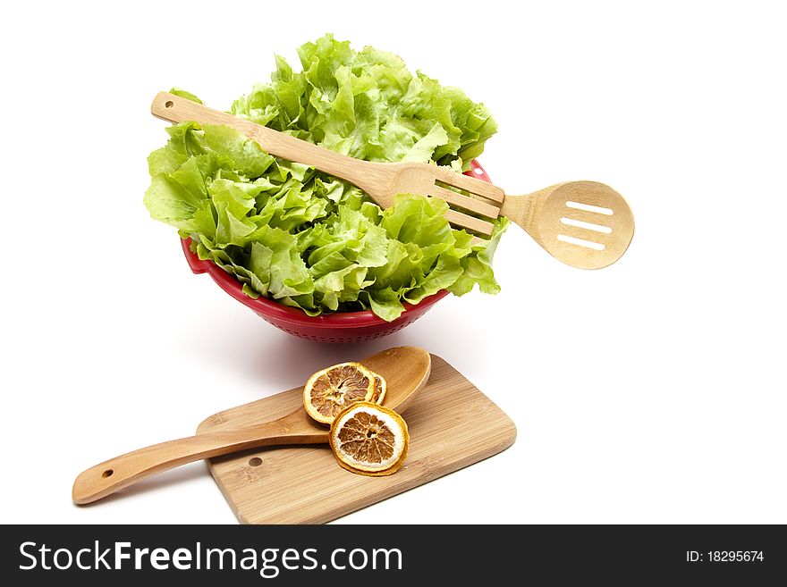 Endives salad in the sieve with cook spoon. Endives salad in the sieve with cook spoon