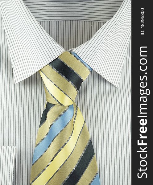Close-up of new shirt with striped silk necktie