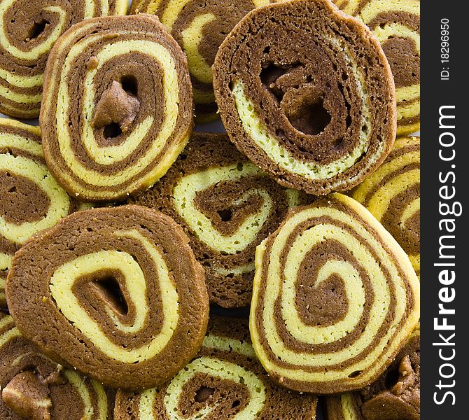 Chocolate spiral cookies for background. Chocolate spiral cookies for background