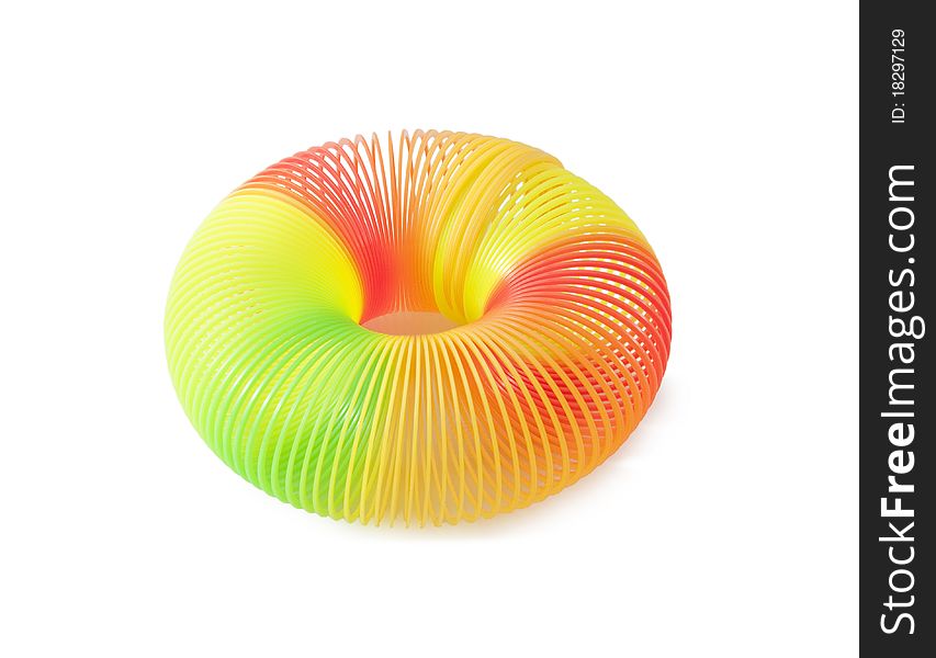 The Plastic toy spring isolated on a white background. The Plastic toy spring isolated on a white background