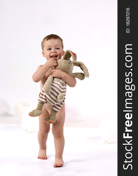 Studio portrait of a little boy with toy