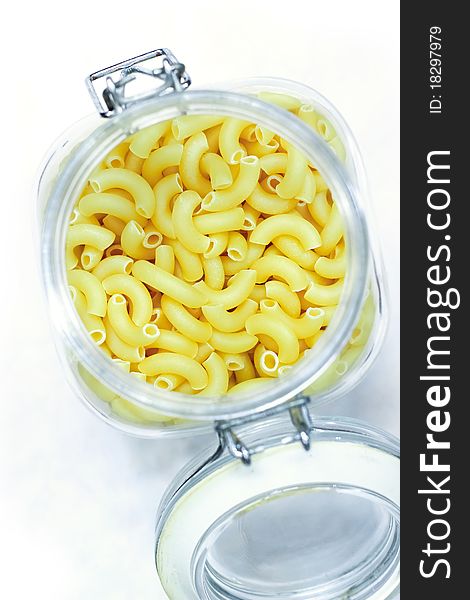Macaroni in bottom on white