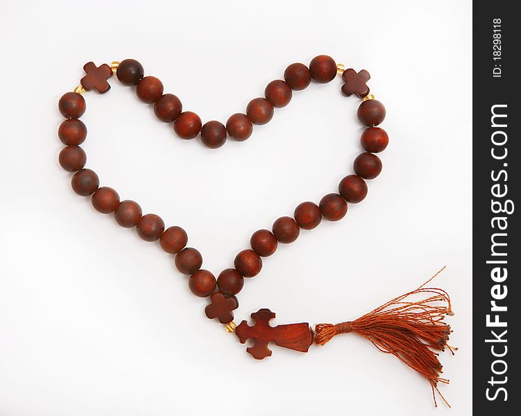 Wooden rosary in the form of heart. Wooden rosary in the form of heart