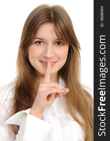 Young woman says ssshhh to maintain silence on a white background