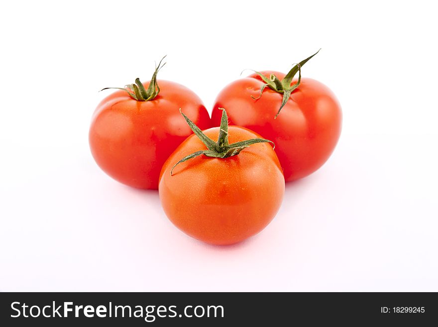 Red tomatoes on white background