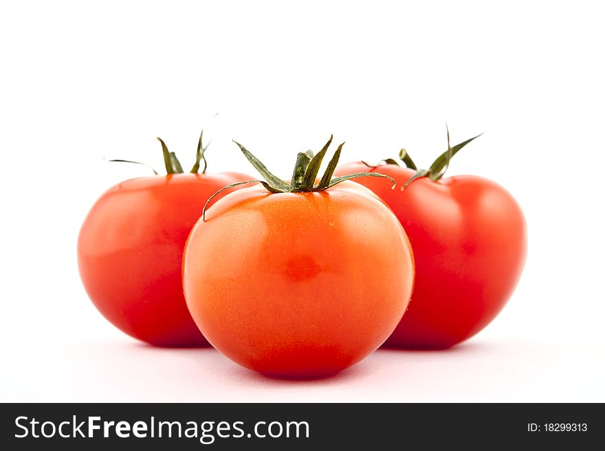 Red tomatoes on white background