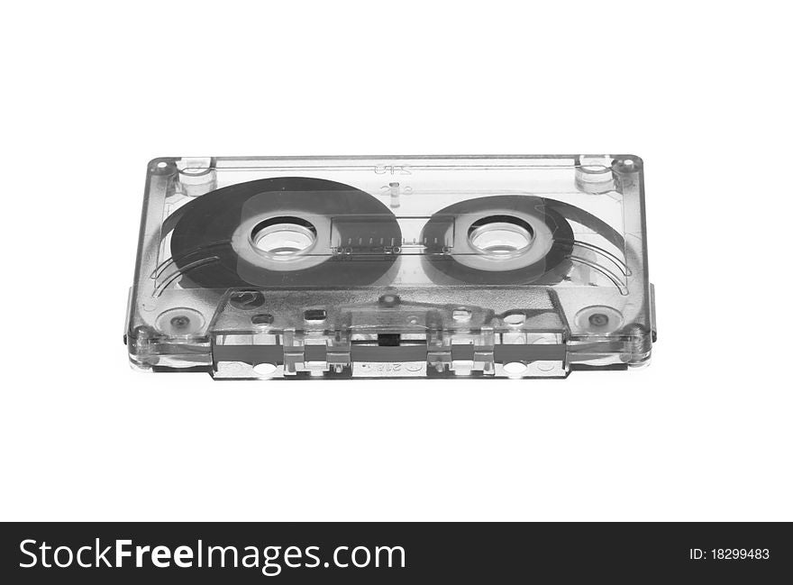 Old magnetic audio tape cassette isolated on white