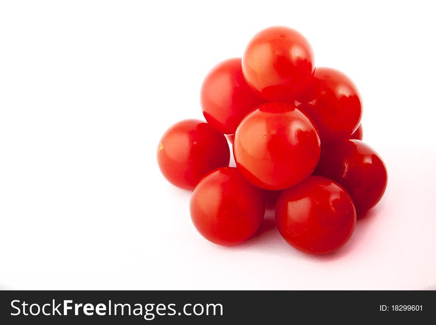 Red tomatoes on white background