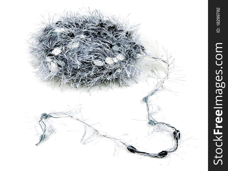 Ball of fluffy gray thread on a white background