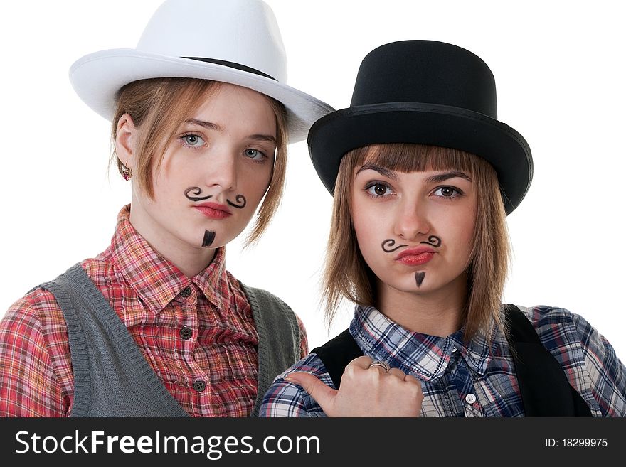 Two girls with painted mustaches and bowler hats on white background