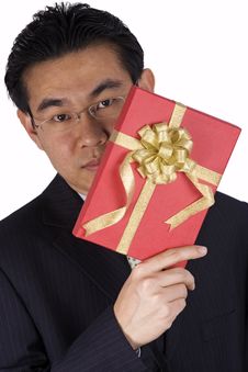 Chinese Businessman Holding Present Royalty Free Stock Photography Chinese Businessman Holding Present Royalty Free Stock Photography