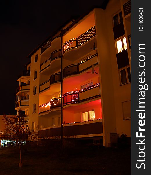 Many difference balconies, night city life Christmas holiday time, many colour lamps. Many difference balconies, night city life Christmas holiday time, many colour lamps
