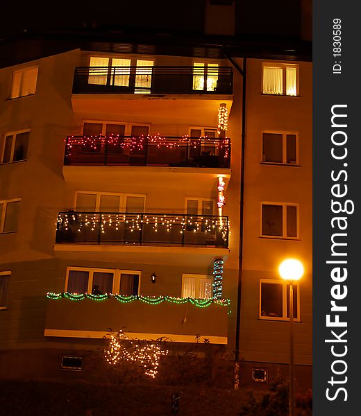 Many difference balconies, night city life  
Christmas holiday time, many colour lamps. Many difference balconies, night city life  
Christmas holiday time, many colour lamps