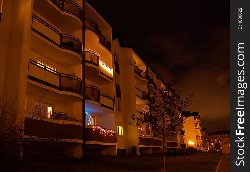 Many difference balconies, night city life Christmas holiday time, many colour lamps. Many difference balconies, night city life Christmas holiday time, many colour lamps