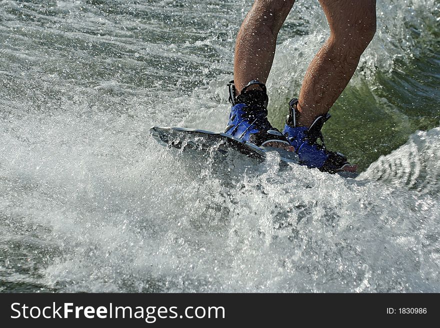 Wakeboard splash - young man wakeboarding