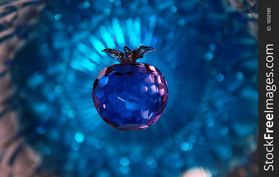 Purple crystal apple with blue crystal background