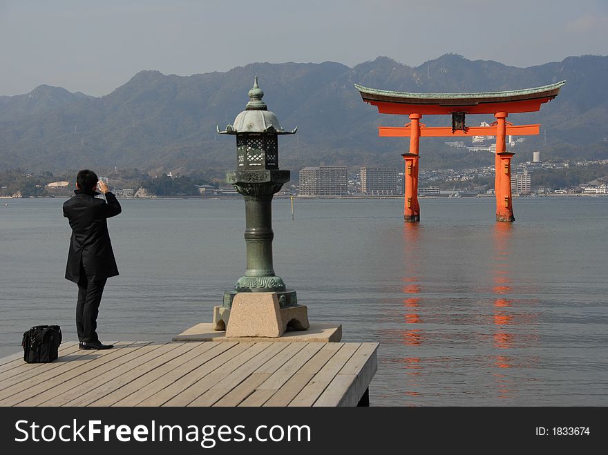 Red floating torii gate outside Itsukushima Shrine at Miyajima at high tide (one of the three most photographed places in Japan)