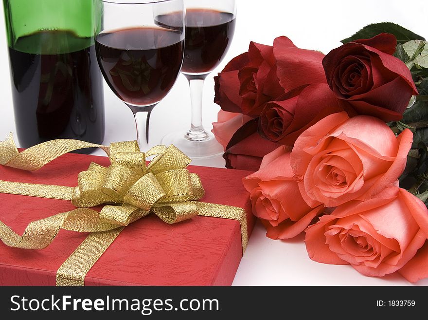 Rose with gift box and red wine. Rose with gift box and red wine.