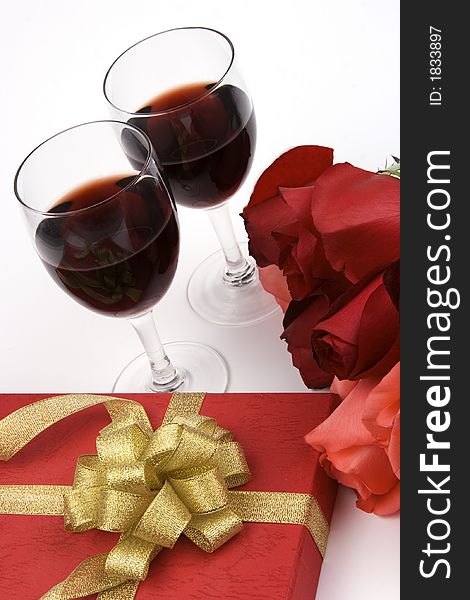 Rose with gift box and red wine. Rose with gift box and red wine.