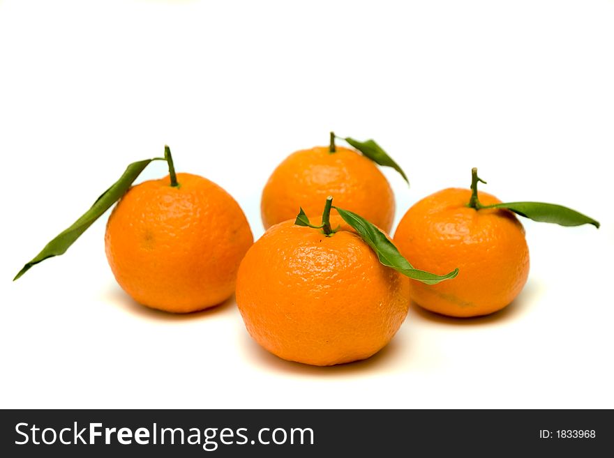 Isolated tangerines with greean leaves