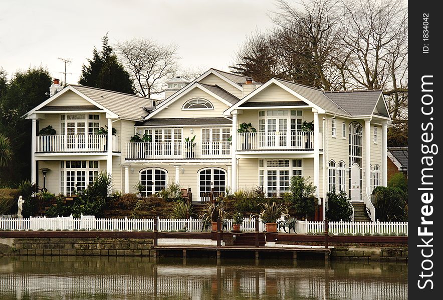 Winter scene of a Luxurious Residence  on the banks of a River in England. Winter scene of a Luxurious Residence  on the banks of a River in England