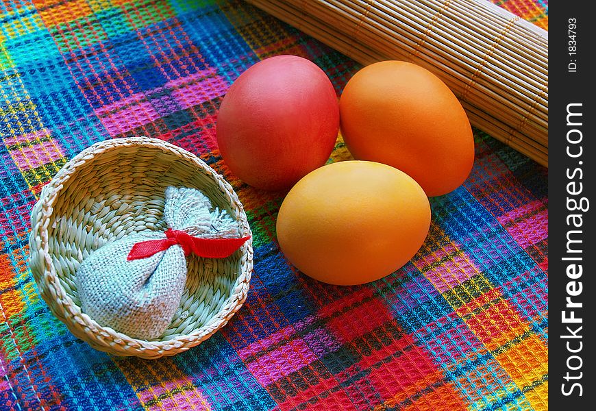 Tree eggs with small basket and linen sack. Tree eggs with small basket and linen sack