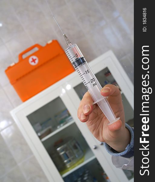 The syringe with a liquid in the medical room