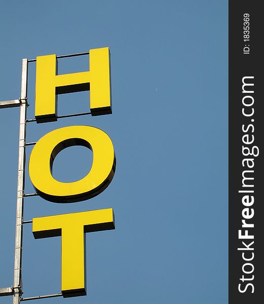 A closeup of the sign of an Hotel