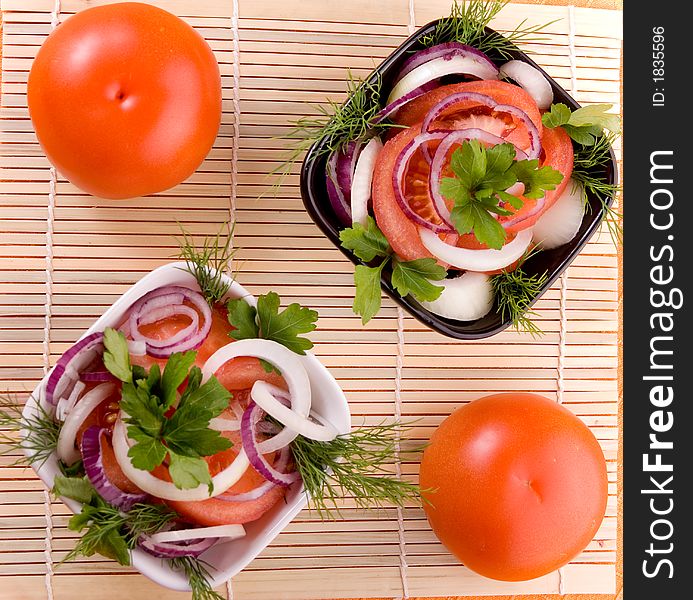 Tomato salad with onion. Vegetarian food.