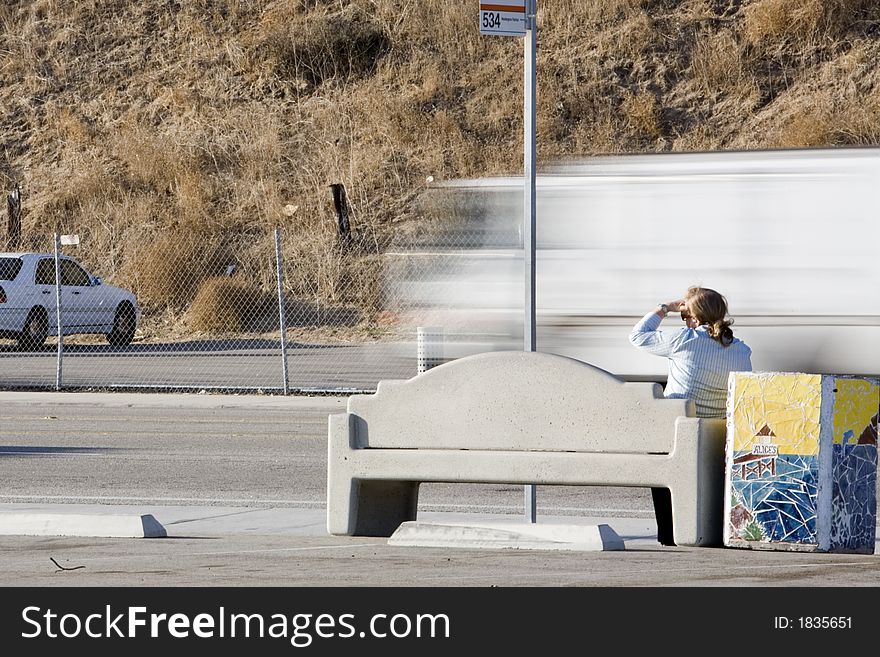 A woman wating for the bus. A woman wating for the bus