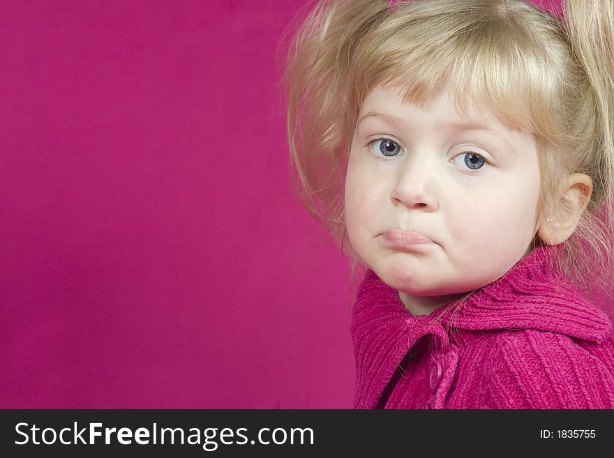 A high key photo of a cute little girl pouting. A high key photo of a cute little girl pouting