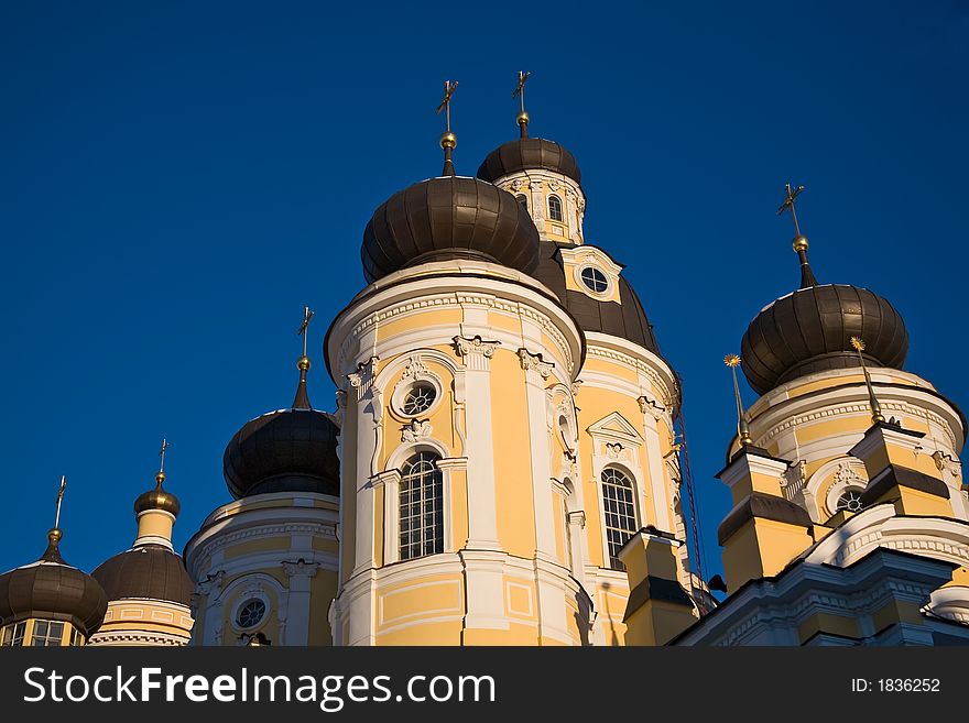 Domes of traditional church with St.-Petersburg in a sunny day