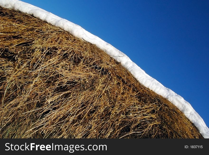 A hay is snow and sky