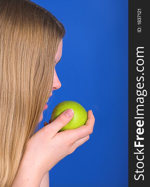 Young woman ready to eat green apple. Young woman ready to eat green apple