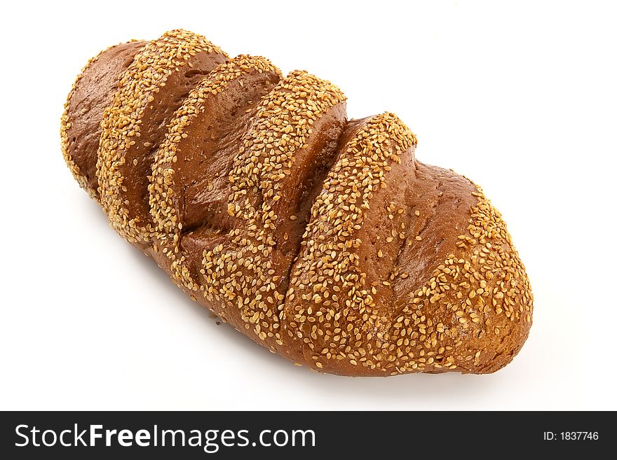 Big long loaf of rye bread with seeds
