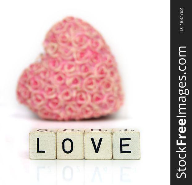 A red heart and cubes with letters on a white background - Love Valentine ´s Day
