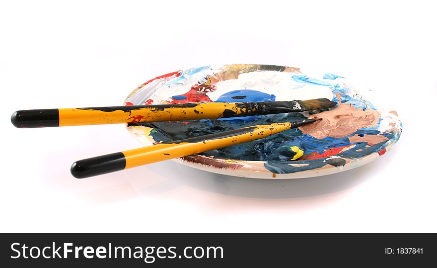 Paint brushes and palette on a white Background. Paint brushes and palette on a white Background