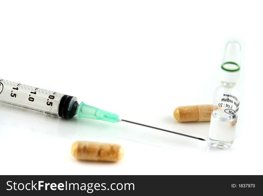 Syringe Pills, and vials on a white background