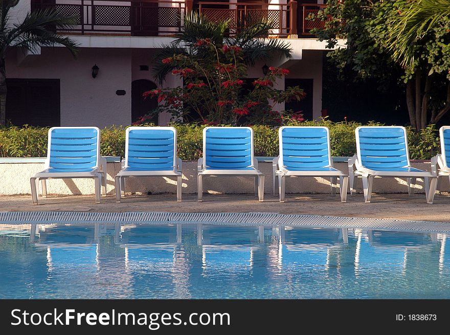 Blue and white swimming pool chairs