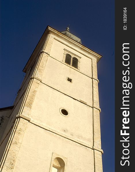 Very high old white church tower and sky. Very high old white church tower and sky