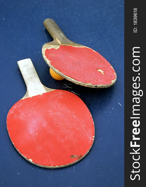 Old red tennis rackets on the table. Old red tennis rackets on the table