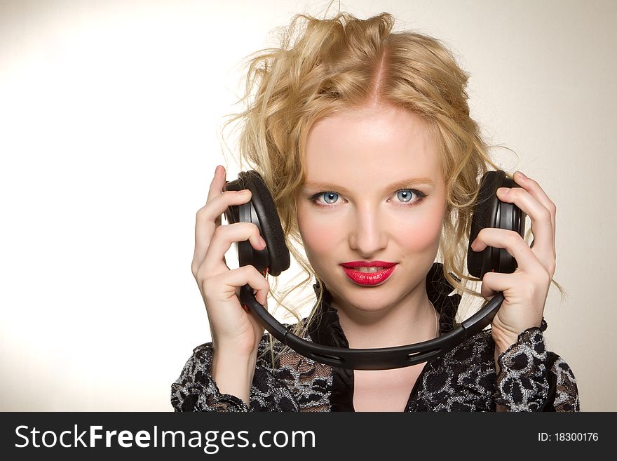 Woman with headphones listening to music over white background