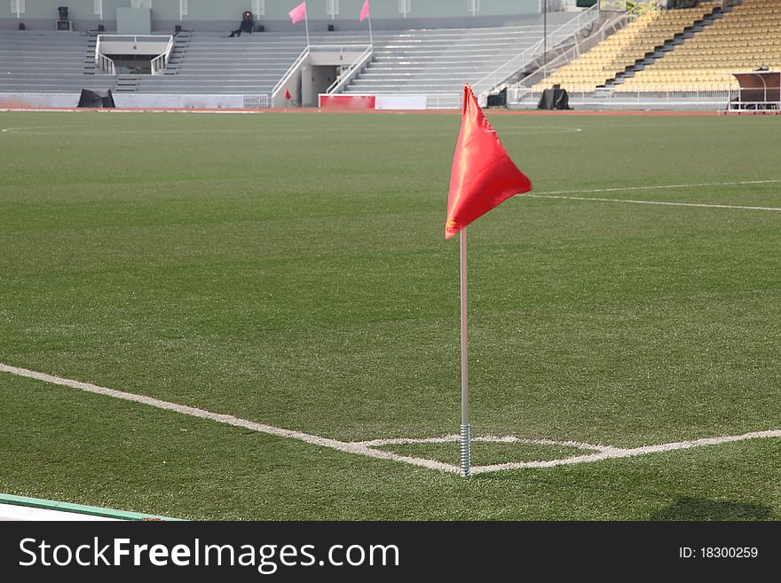 Soccer corner flag in a large stadium filled