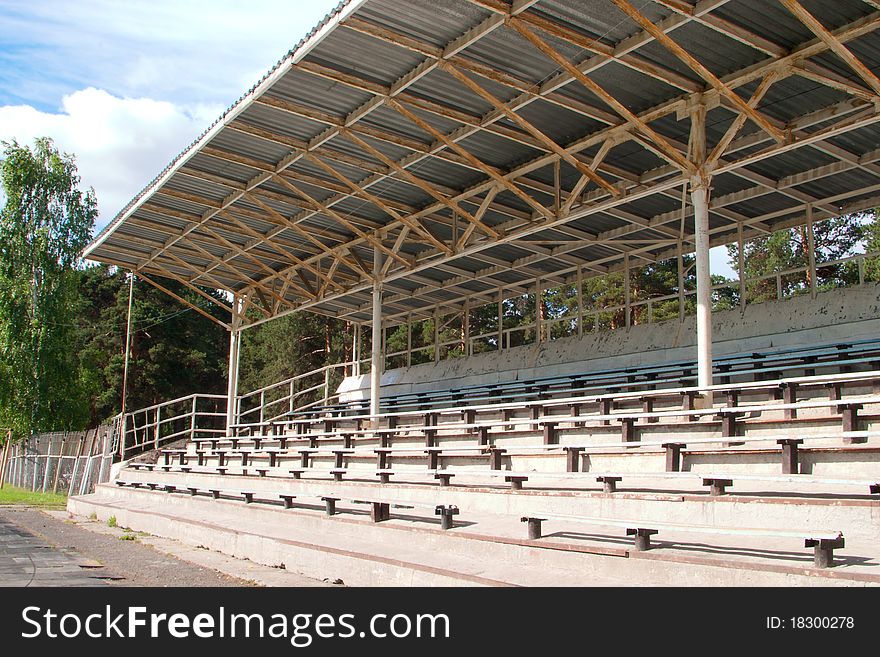 The small stadium with seating and a roof