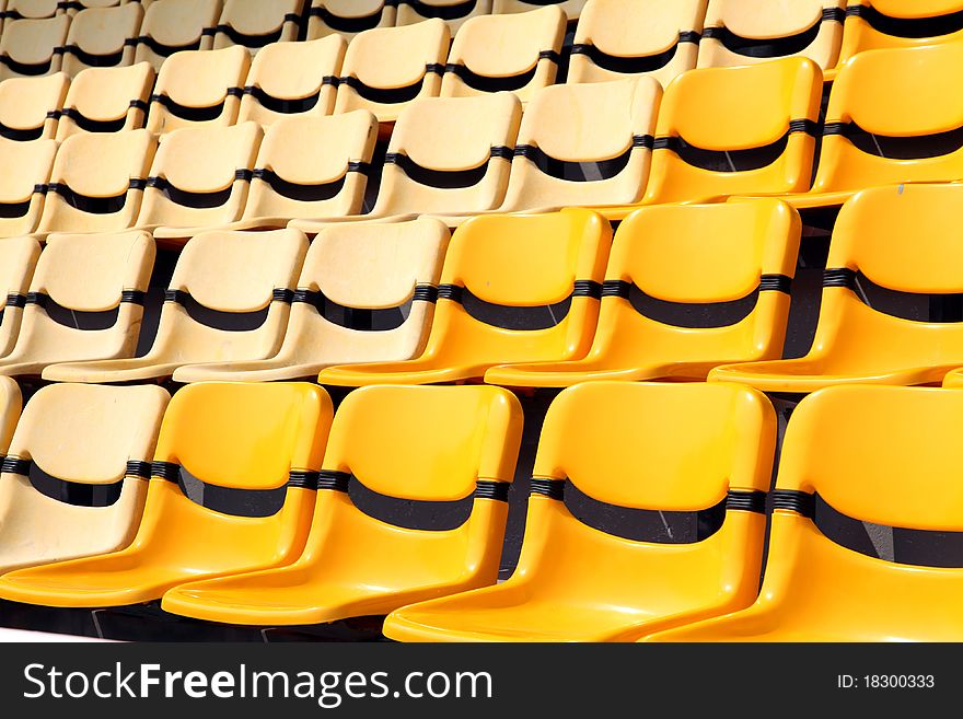 Old and new yellow seat in stadium