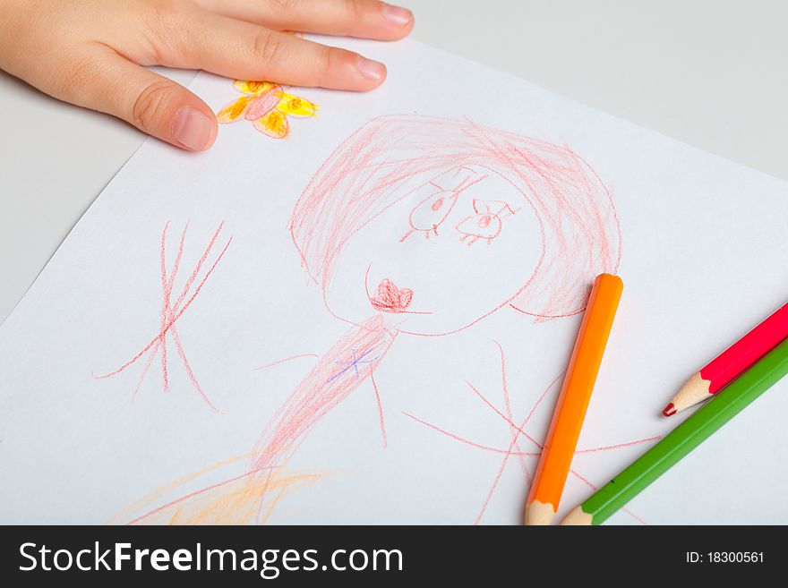 The child draws a picture with crayons. The concept of teaching drawing, children's creativity. The child draws a picture with crayons. The concept of teaching drawing, children's creativity